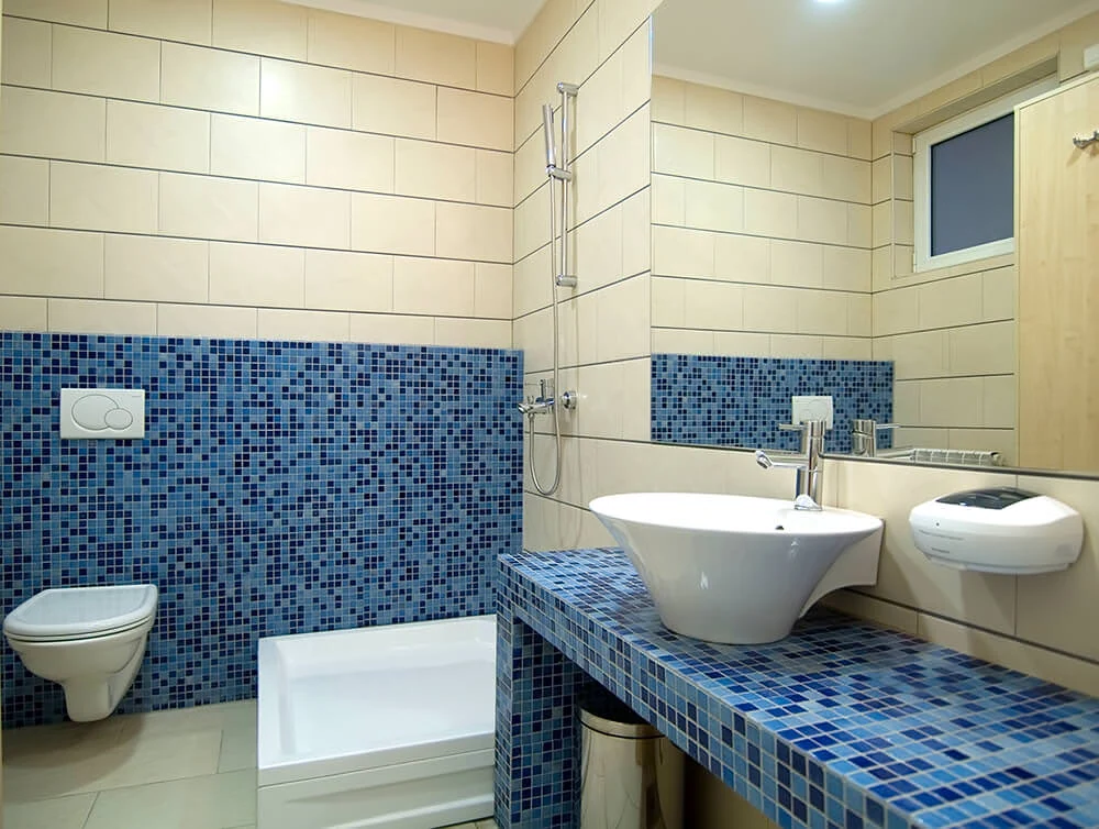 blue hexagonal tiles on the floor and wall