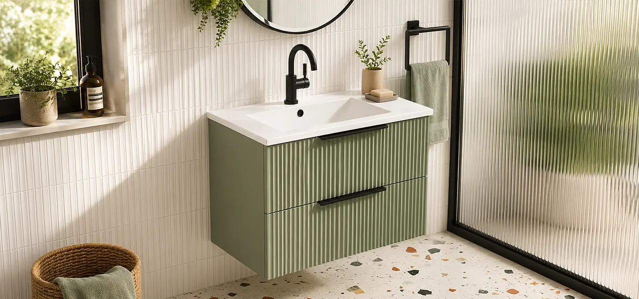 Sage green fluted wall-hung two-drawer vanity unit with a white basin and chrome tap.