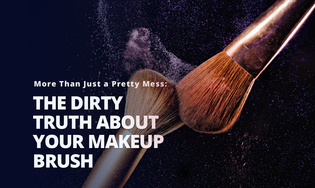 Two makeup brushes dispersing powder against a black background.