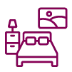 Bedroom icon showing a bed with pillows beside a bedside cabinet and framed wall art.